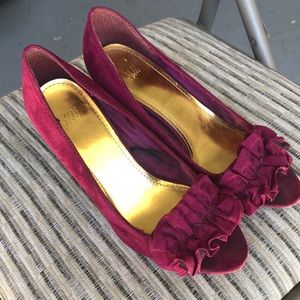 Pair of high heels fuchsia color velvet